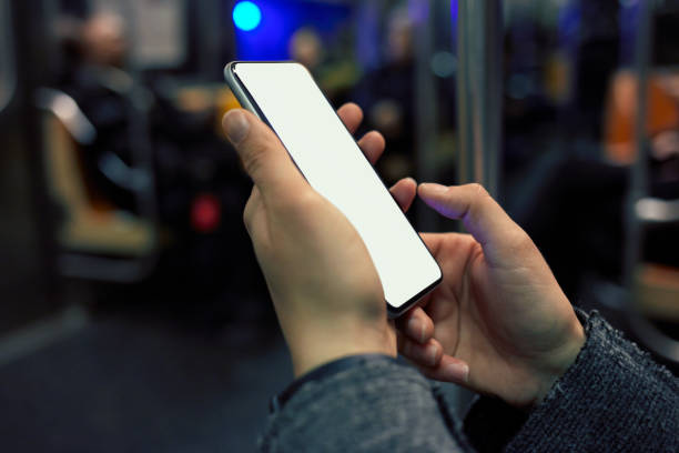 istock Women using smartphone in public transport 1002888720
