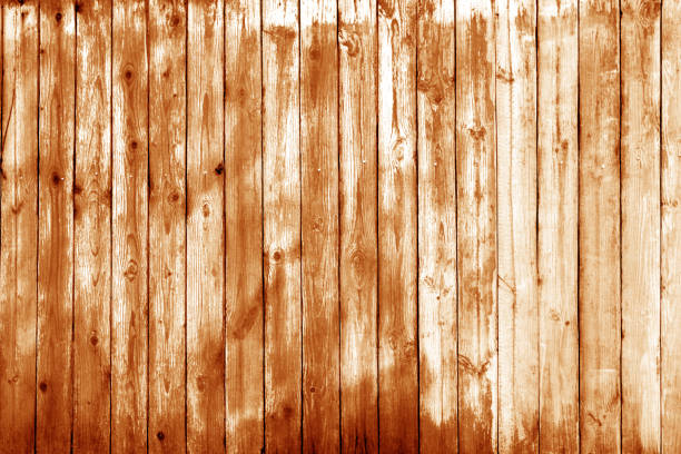 istock Wooden wall texture in orange tone. 1002889928