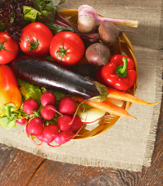 istock salad from fresh vegetables in a plate on a table, selective focus 1002893150