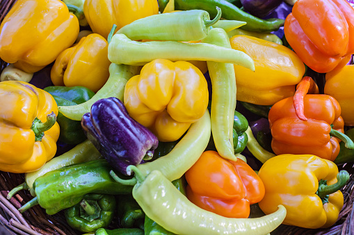 Close-up of assorted peppers in a basket.