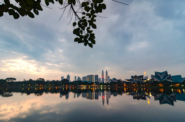 istock Kuala Lumpur City with reflection on the lake 1002894852