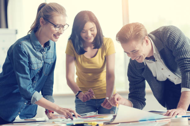 istock Happy male person working in friendly collective 1002906880