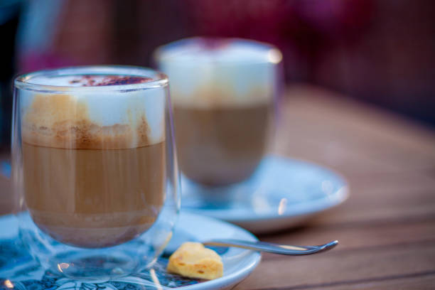 istock The cappuchino coffee in glass cup staying on the table 1002917974