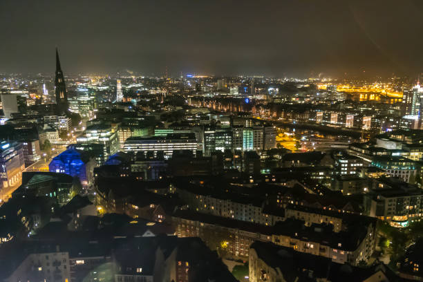 istock Hamburg Germany cityscape in night time 1002918398