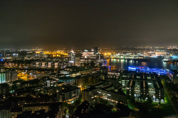 istock Hamburg Germany cityscape in night time 1002918452