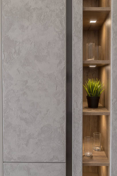 istock Artificial flower on the shelf in the closet with a new design and lighting 1002921236
