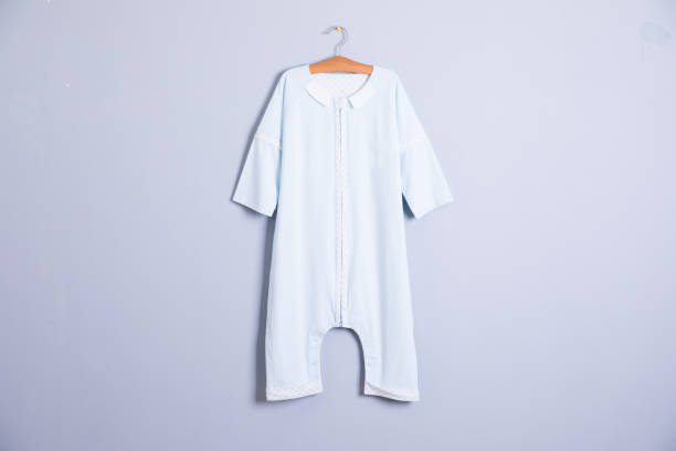 istock Baby clothes and accessories on wooden background 1002929312