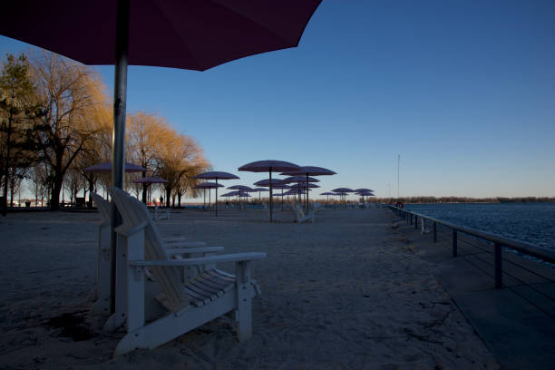 istock breach chairs with umbrella in sunset colour 1002930172