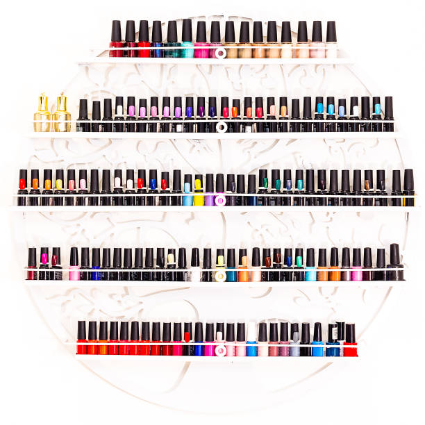 Set of nail polishes on a wall in beauty salon stock photo