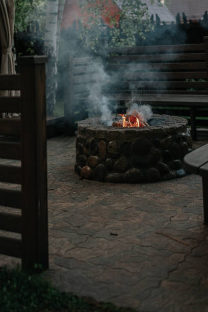 istock Flame and smoke of fire in the stone hearth 1002936590