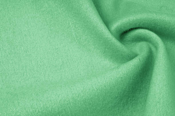 istock Texture, background, pattern. Woolen fabric for outdoor clothing, pale green. Colorful, fresh spring fresh green. More of this motif and more textiles in my port. 1002937144