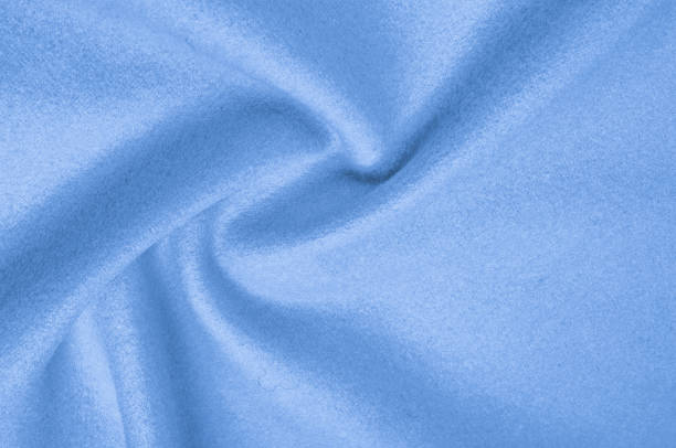 istock Texture, background, pattern. Woolen fabric for outdoor clothing, pale blue. Colorful, fresh spring blue. More of this motif and more textiles in my port. 1002937150