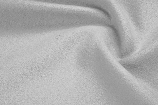 istock Texture, background, pattern. Woolen fabric for outdoor clothing, white gray 1002937168
