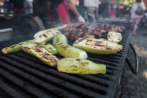 istock Zucchini and meat shish cooking on a grill. 1002946736