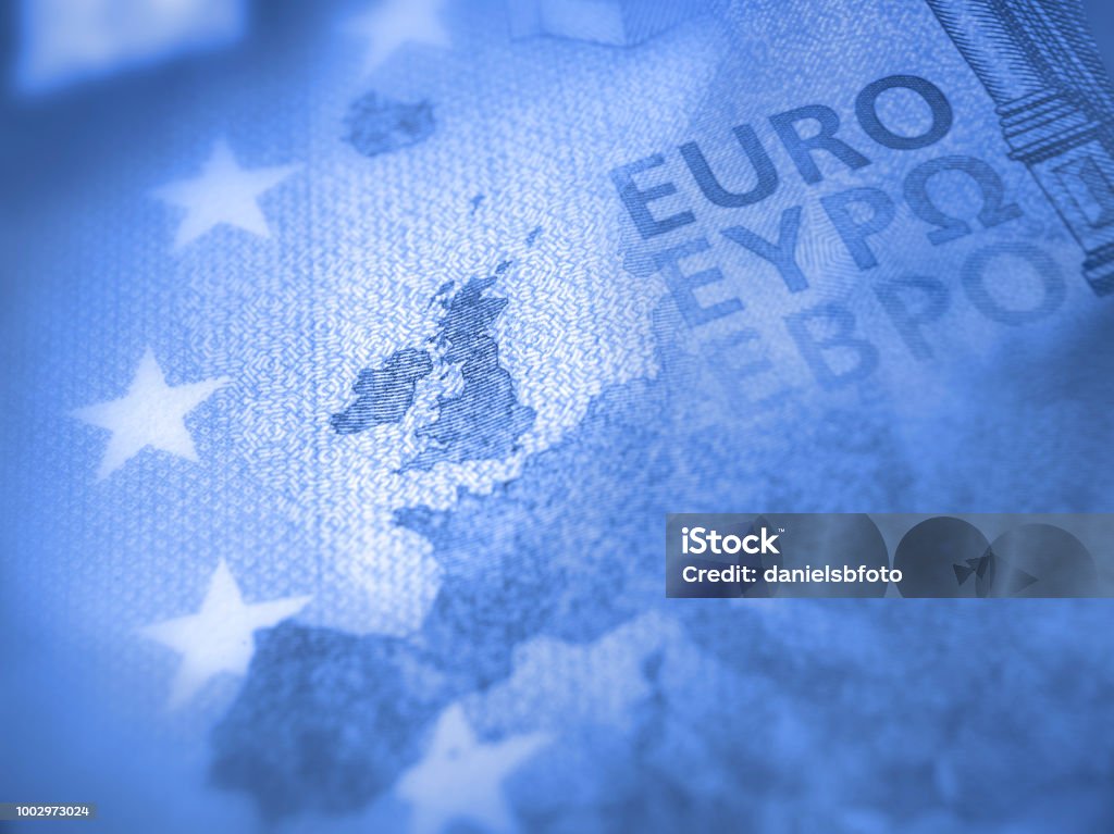 Europe map of Euro bill with focus on Great Britain. Brexit concept Unfocused Euro bill close up detail of Europe map with focus on Great Britain. Brexit concept in blue color European Union Currency Stock Photo