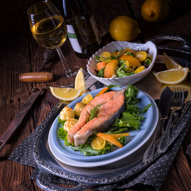 istock salmon with butter fried potato puree and salad 1002985330