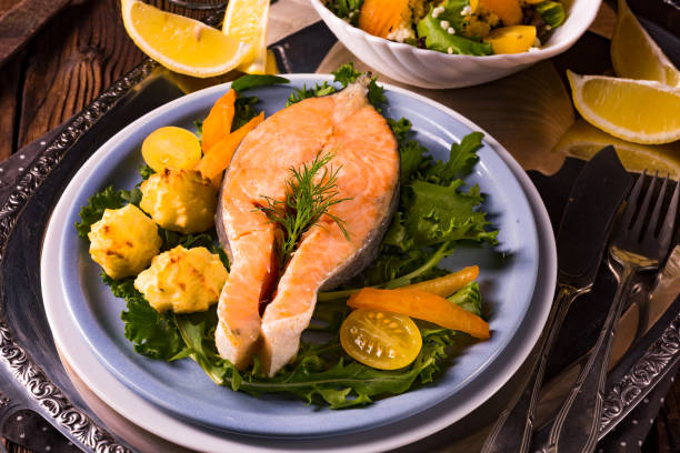 istock salmon with butter fried potato puree and salad 1002985496