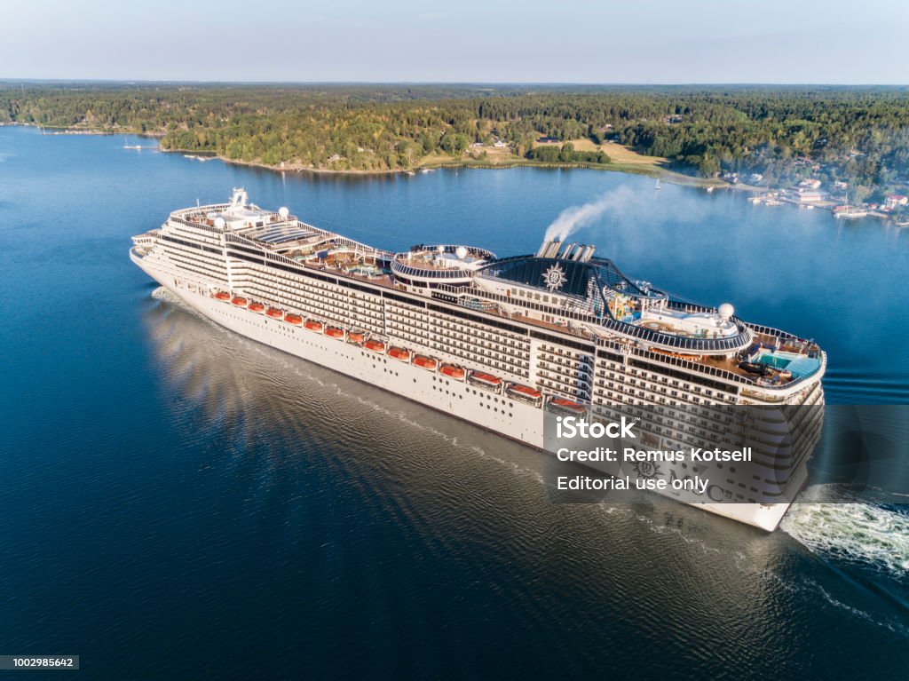 MSC Preziosa Cruiser Ship passing by in the Stockholm Swedish archipelago Skeppsdal, Stockholm, Sweden - July, 17th 2018: MSC Preziosa Cruiser Ship passing by in the Stockholm Swedish archipelago. Cruise - Vacation Stock Photo