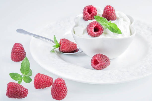 istock Natural bulgarian yogurt with raspberries 1002989436