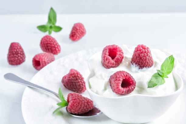 istock Natural bulgarian yogurt with raspberries 1002989440