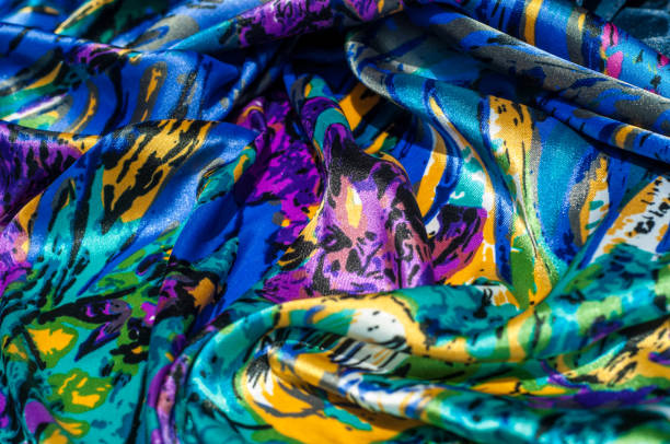 istock Texture, fabric, background. Women's scarf. Silk fabric is blue, floral pattern. Abstraction 1002993780