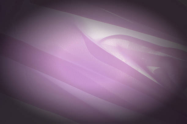 istock Texture, background, pattern. Silk fabric pale pink, abstract folds 1002993786