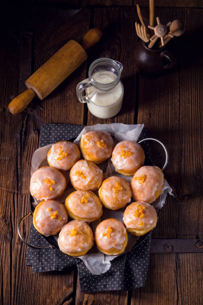 a tasty Berliner (doughnut) a tasty Berliner (doughnut)a tasty Berliner (doughnut) fastnacht stock pictures, royalty-free photos & images