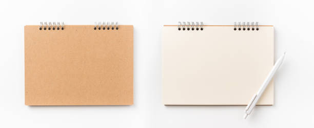 istock Top view of kraft spiral notebook, blank page and wood pen 1002996358