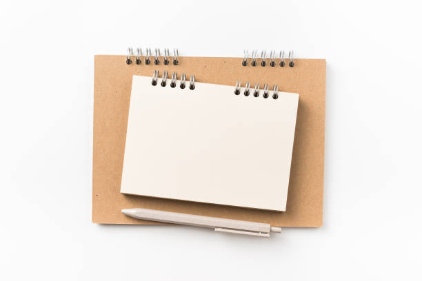 istock Top view of two kraft spiral notebook, blank page, mechanical pencil 1002999918