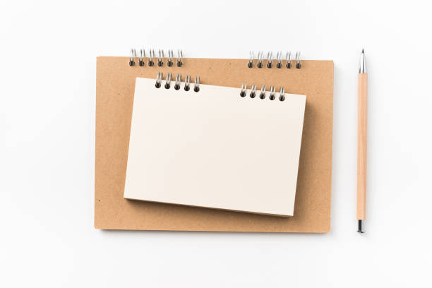 istock Top view of two kraft spiral notebook, blank page, mechanical pencil 1003000018