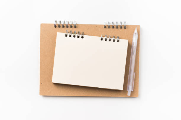 istock Top view of two kraft spiral notebook, blank page, mechanical pencil 1003000088