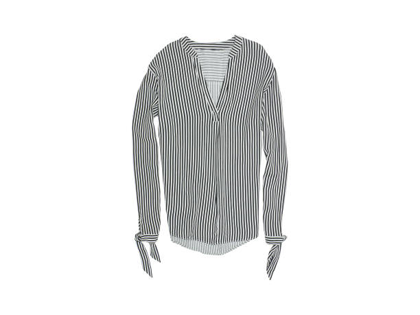 istock Striped blouse on a white background. Isolate. Fashionable concept 1003018354