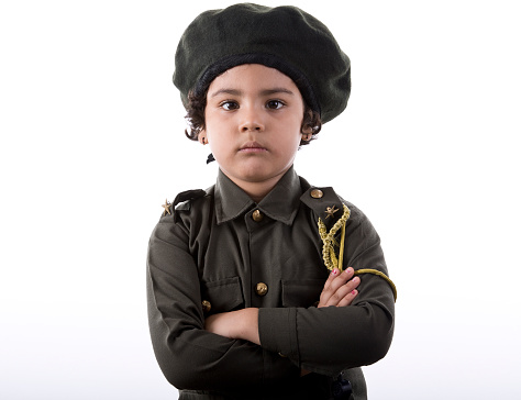 Portrait of little Indian girl in police costume