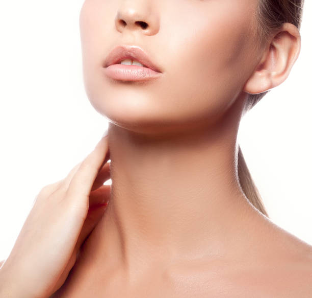 Lips, hand and neck of model girl stock photo