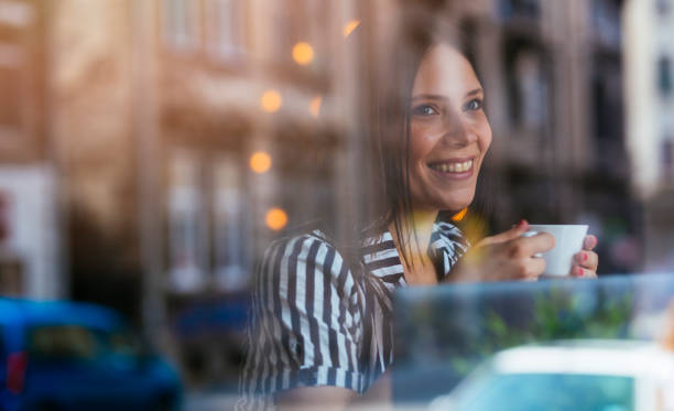 istock Young woman looking out the window 1003068334