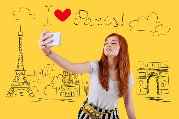 istock Young woman posing and taking a selfie in Paris 1003086782