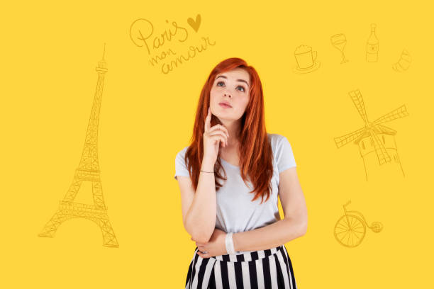 istock Calm girl touching her face while thinking about Paris 1003089594