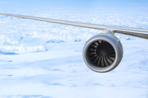 airplane engine above Greenland with ocean and glaciers