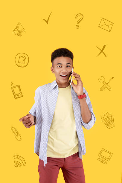 istock Emotional student feeling excited while talking on the phone 1003090346