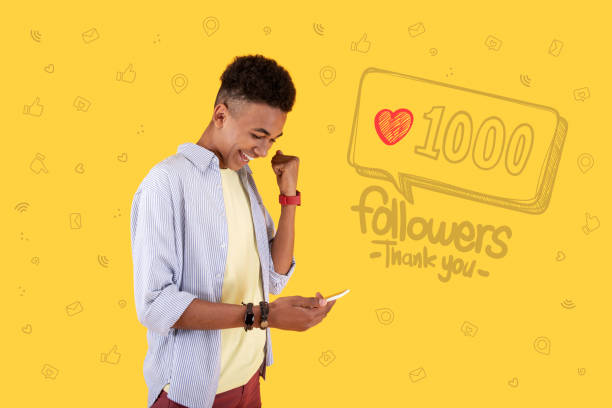 istock Popular blogger feeling excited while getting one thousand followers 1003090422