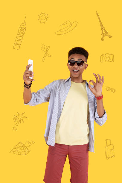 istock Emotional student traveling around the world and taking selfies 1003090772