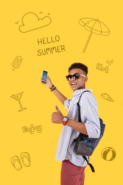 istock Relaxed young man putting his thumb up while enjoying summer holidays 1003090986