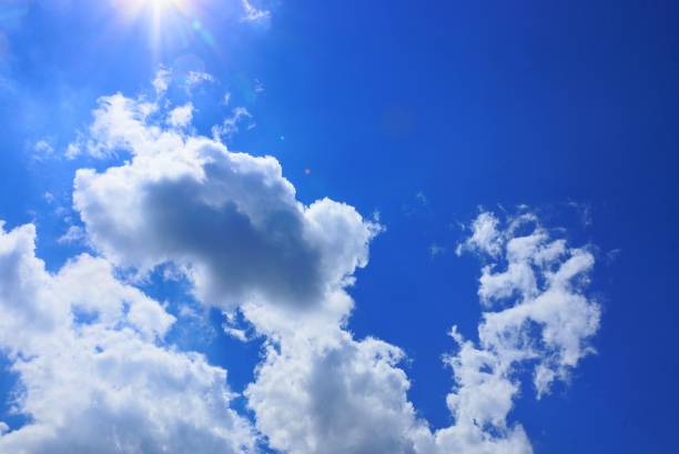 istock a lot of white clouds in the blue sunny sky 1003091112