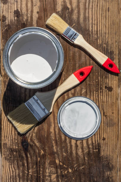 istock Paint and brush on a wooden background with copy space 1003095092