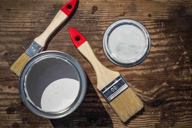 istock Paint and brush on a wooden background with copy space 1003095094