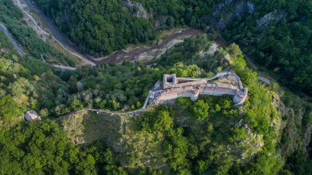 ruined Poenari Fortress on Mount Cetatea in Romania stock photo