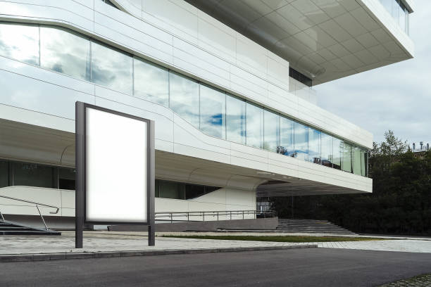 istock Blank white banner next to white modern business center. 3d rendering 1003110780