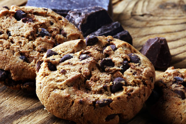 istock Chocolate cookies on table. Chocolate chip cookies shot with chocolate 1003110818