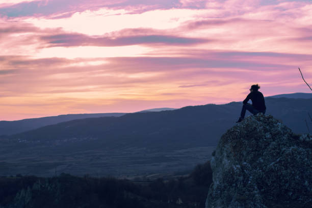 istock Man on top of the mountain 1003111276