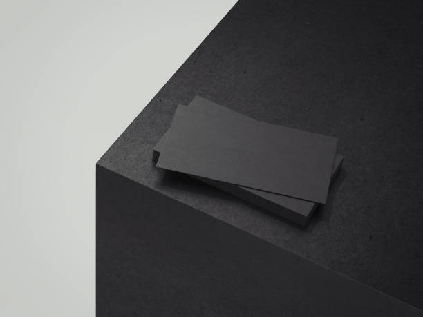 istock Black business cards on black cube, 3d rendering. 1003111954